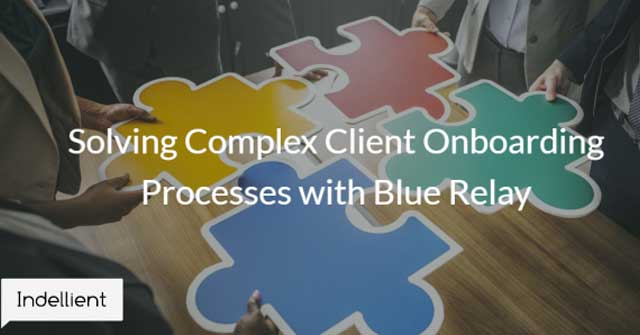 Photo of people putting together four large puzzle pieces, each one a different colour of red, green, blue, or yellow